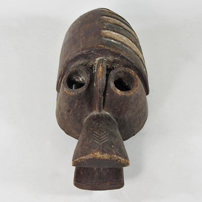 Lot 37 - An African carved wooden tribal mask, probably...