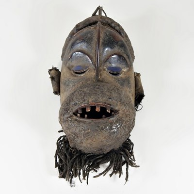 Lot 430 - An African carved wooden tribal mask, with a...