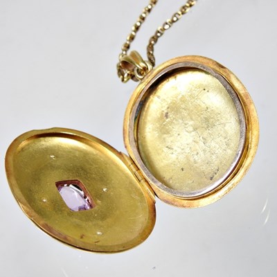 Lot 76 - A Victorian diamond and gem set gilt locket,...