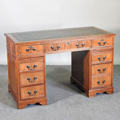 Lot 541 - A reproduction yew wood pedestal desk, on...