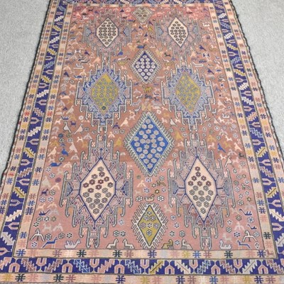 Lot 330 - A Persian kilim, with coloured diamonds, on a...