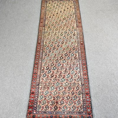 Lot 229 - A Persian runner, with rows of all over...