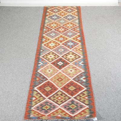 Lot 248 - A Turkish kilim runner, decorated with...