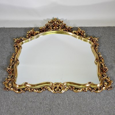 Lot 408 - An ornate gilt framed over mantel mirror, with...