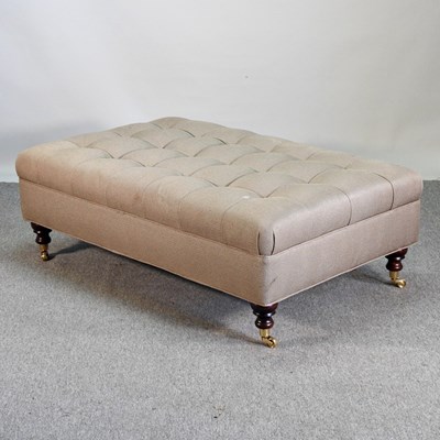 Lot 254 - A modern tan upholstered footstool, on turned...