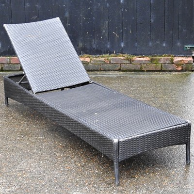 Lot 415 - A rattan sun lounger, 183cm long