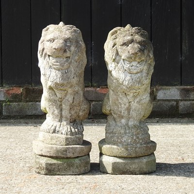Lot 308 - A pair of reconstituted stone garden models of lions