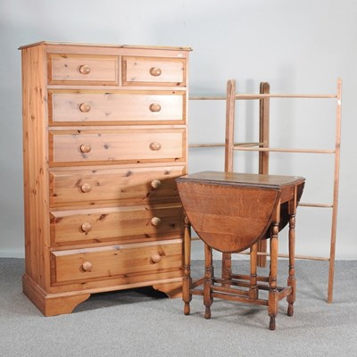 Lot 385 - A modern pine chest of drawers, together with...