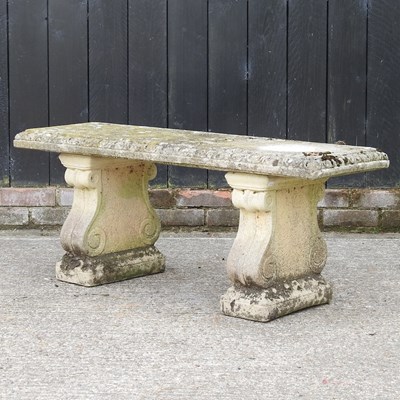 Lot 304 - A reconstituted stone garden bench