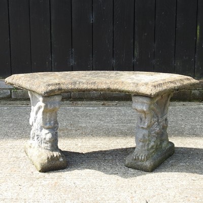 Lot 310 - A reconstituted stone curved garden bench