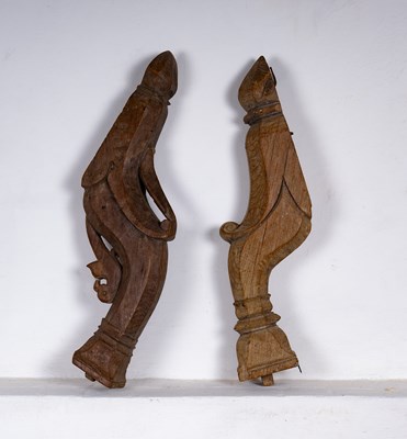 Lot 356 - A near pair of carved oak brackets or supports,...