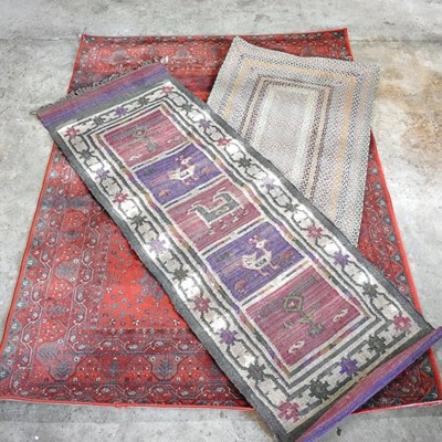 Lot 308 - A Turkish rug, on a red ground, together with...