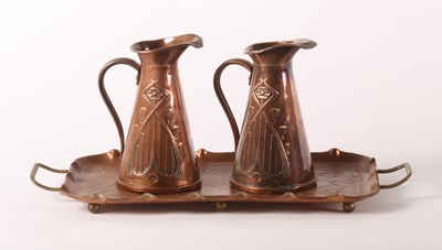 Lot 54 - Joseph Sankey, two Arts and Crafts copper jugs,...