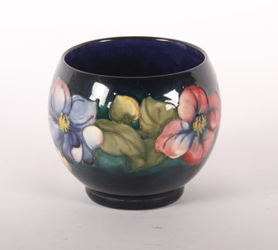 Lot 44 - A Moorcroft pottery jardiniere, tube-line...