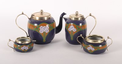 Lot 166 - A four piece tea service, enamel decorated...