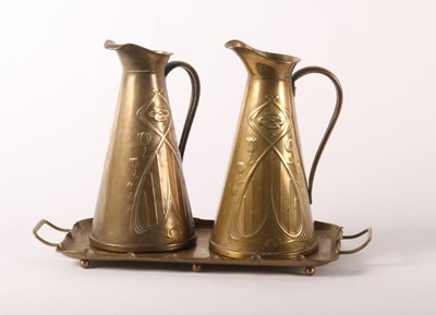 Lot 53 - Joseph Sankey, two Arts and Crafts brass jugs,...