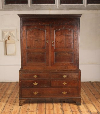 Lot 374 - A George III oak cupboard, the upper section...