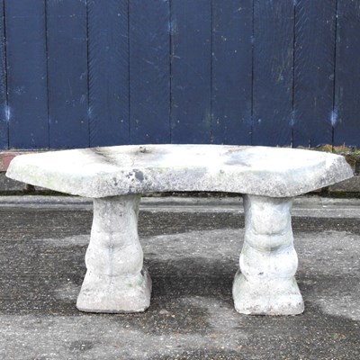 Lot 464 - A cast stone garden seat, of curved design