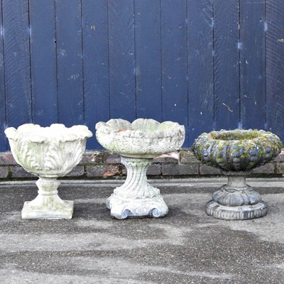 Lot 181 - A cast stone garden pot, together with two...