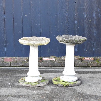 Lot 67 - A cast stone garden bird bath, on a column...