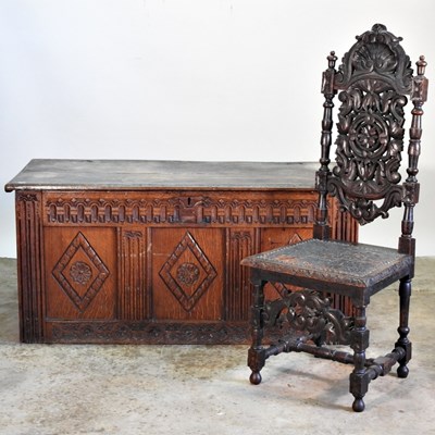 Lot 460 - An 18th century carved oak coffer, with carved...