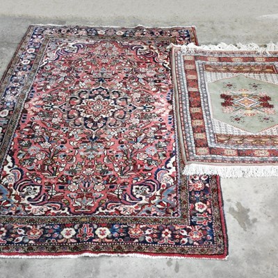 Lot 367 - A Turkish woollen rug, with floral designs, on...