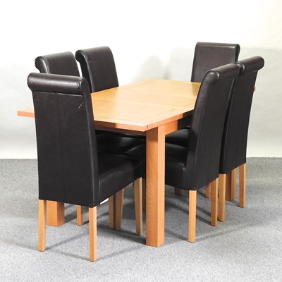 Lot 523 - A modern oak extending dining table