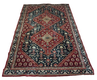 Lot 291 - A Turkish style rug, on a red ground, 335 x 243cm