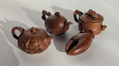 Lot 221 - A collection of four Chinese miniature wood...