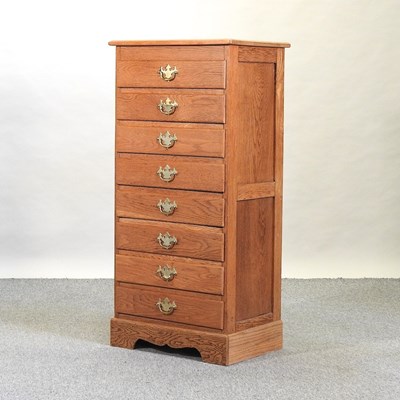 Lot 396 - A modern narrow oak chest of drawers