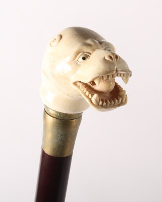 Lot 151 - A walking stick, having a carved bone handle...