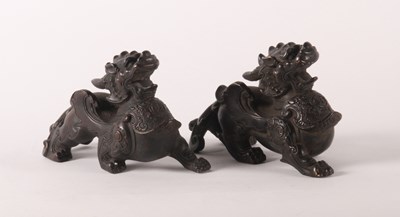 Lot 226 - A pair of Chinese bronze models of dragons,...