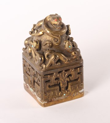 Lot 217 - A Chinese gilt bronze seal, decorated with...