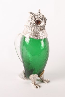 Lot 130 - A green glass claret jug, in the form of an...