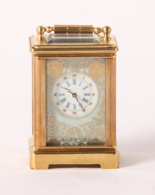 Lot 247 - A brass minuet carriage clock, inset with four...