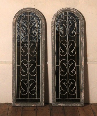 Lot 269 - A pair of grey painted arched garden mirrors,...