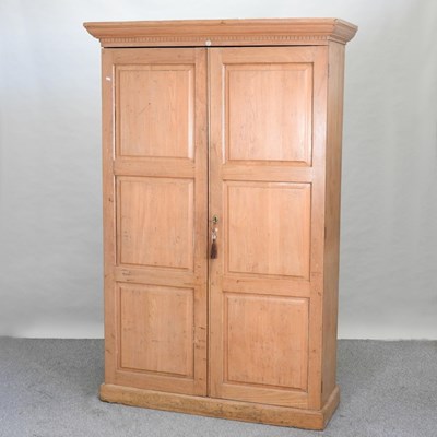 Lot 400 - An early 20th century light oak school cupboard