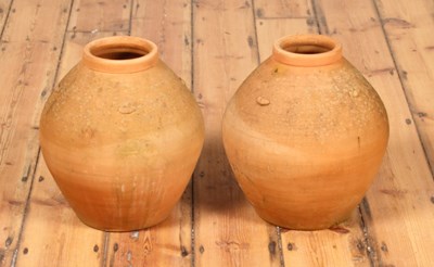 Lot 431 - A pair of terracotta honey pots, each of ovoid...