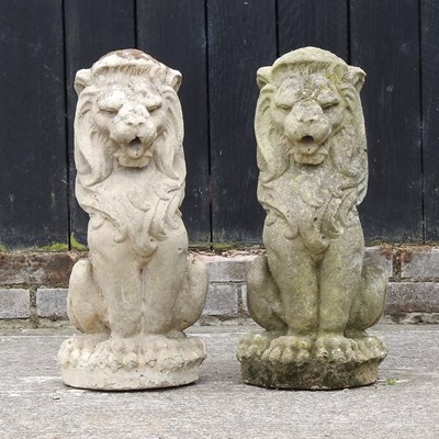 Lot 319 - A pair of reconstituted stone models of seated lions