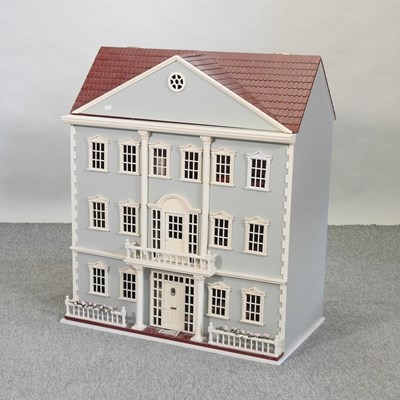 Lot 384 - A painted wooden doll's house