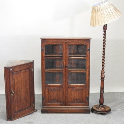 Lot 574 - A reproduction glazed oak bookcase
