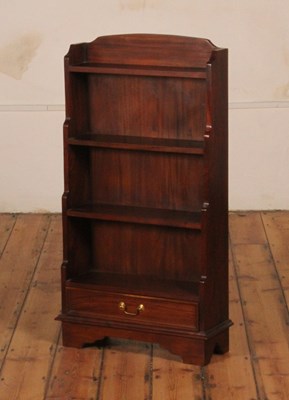 Lot 423 - A Georgian style mahogany waterfall bookcase,...