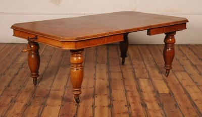 Lot 428 - A Victorian oak extending dining table, having...