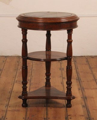 Lot 409 - A mahogany circular three-tier occasional...