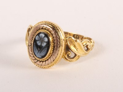 Lot 70 - A Victorian 18ct gold cameo ring, decorated...