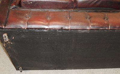 Lot 582 - A red upholstered chesterfield sofa