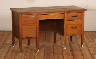 Lot 435 - An oak desk, mid-20th century, having a...