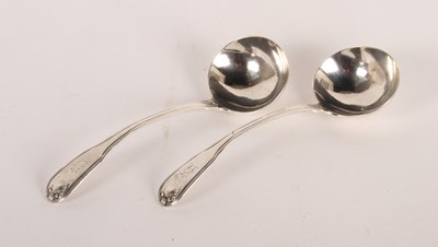 Lot 116 - A pair of George III silver sauce ladles,...