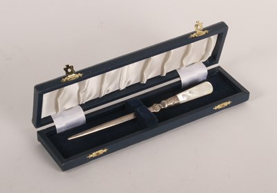 Lot 104 - A silver paper knife with mother of pearl...