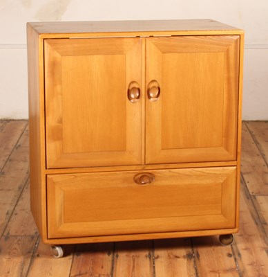 Lot 368 - An Ercol blonde elm Windsor cupboard, on...